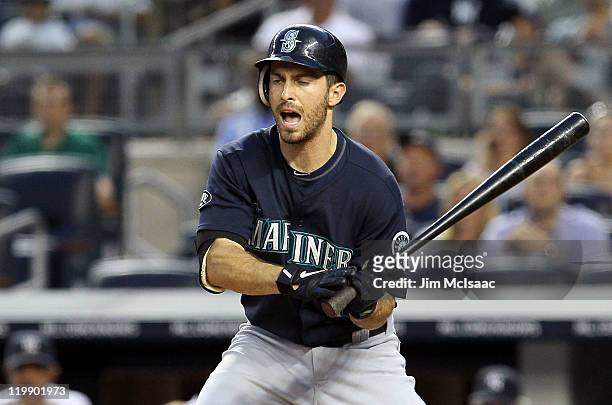 Dustin Ackley of the Seattle Mariners reacts after striking out to end the fourth inning against the New York Yankees on July 26, 2011 at Yankee...