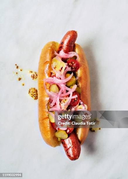 gourmet hot dogs white background - hotdog stock-fotos und bilder