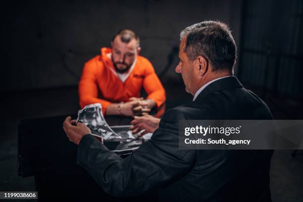 prisoner and detective - criminal lawyer stock pictures, royalty-free photos & images