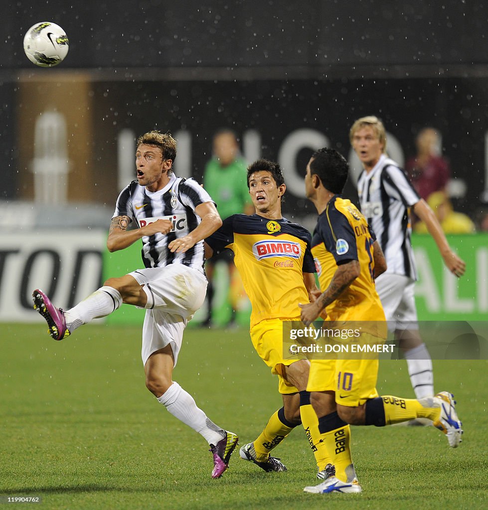 Claudio Marchiso (L) of Juventus moves t