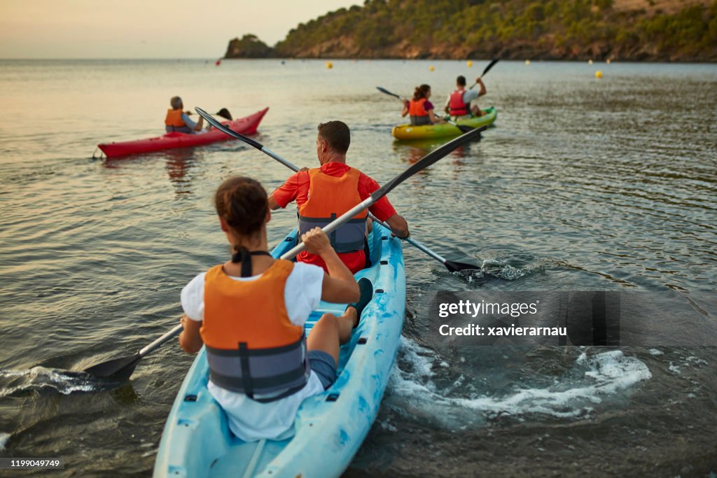 Tandem Kayakers Paddling off the Costa Brava at Dawn