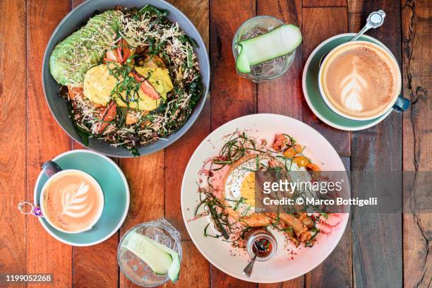 brunch meal for two with cappuccino on wooden table - mexican rustic bildbanksfoton och bilder