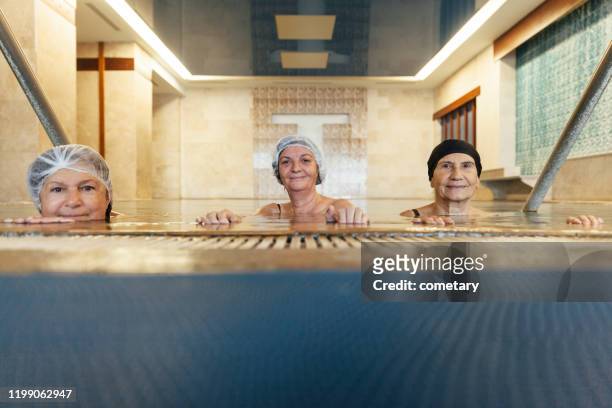 friendship relaxing thermal pool - thermal pool stock pictures, royalty-free photos & images