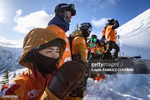 Freeride racers face the competition site, the Ozone face , during the face check ahead of the second stage of the Freeride World Tour skiing and...