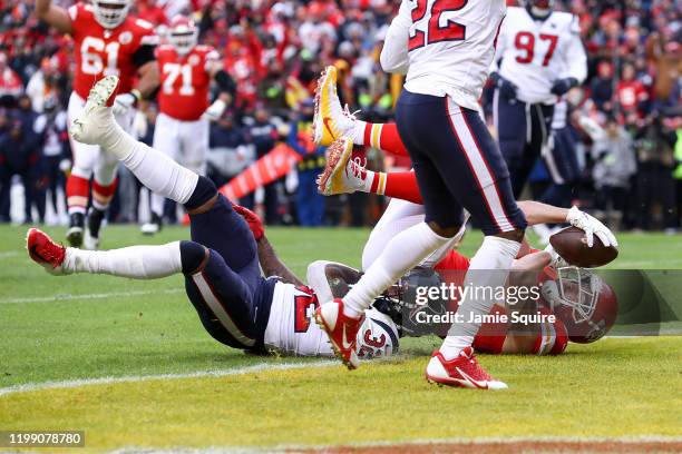 Travis Kelce of the Kansas City Chiefs catches touchdown reception against Lonnie Johnson Jr. #32 the Houston Texans during the second quarter of the...