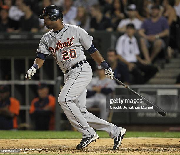 Wilson Betemit of the Detroit Tigers drives in the winning run in the 8th inning against the Chicago White Sox at U.S. Cellular Field on July 26,...