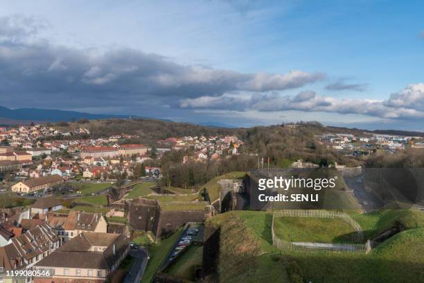 aerial view of belfort castle and the cityscapes in a sunny day - belfort foto e immagini stock