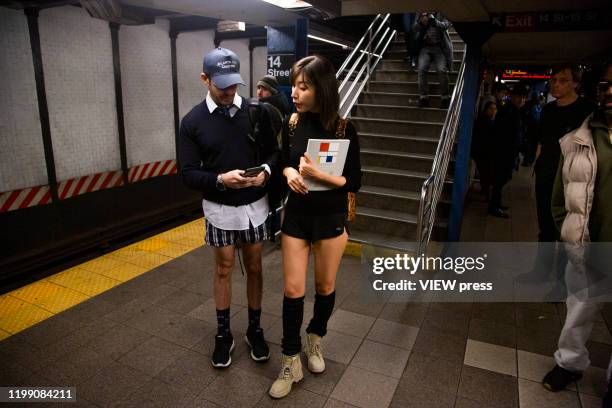 Participants of the No Pants Subway Ride wait for the train at the NYC subway system on January 12, 2020 in New York City. The annual event, in which...