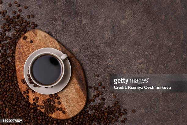 coffee cup and beans on old kitchen table. top view with copyspace for your text - coffee top view stock-fotos und bilder