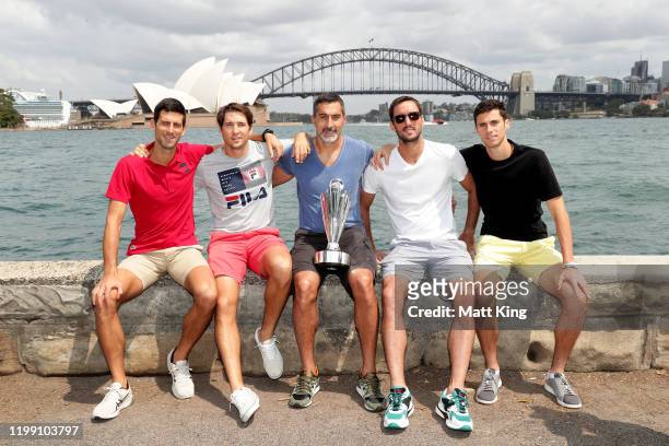 Novak Djokovic, Dusan Lajovic, Nenad Zimonjic, Viktor Troicki and Nikola Cacic of Team Serbia pose with the ATP Cup during a media opportunity after...