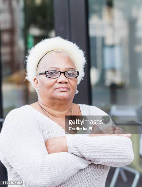 senior african-american woman with unique style - senior colored hair stock pictures, royalty-free photos & images