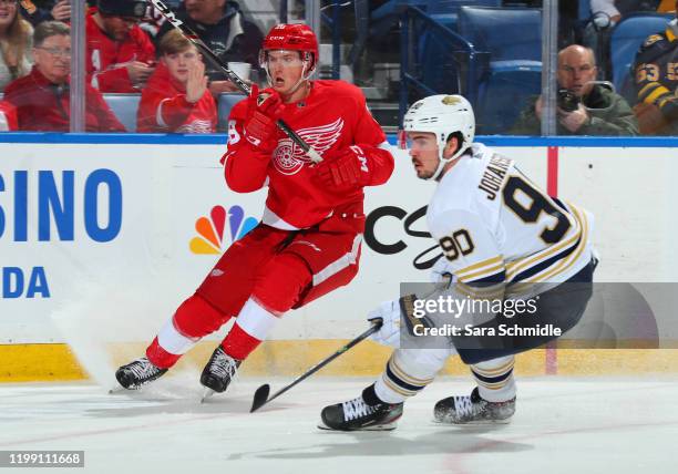 Gustav Lindstrom of the Detroit Red Wings skates in his 1st NHL game against Marcus Johansson of the Buffalo Sabres on February 6, 2020 at KeyBank...