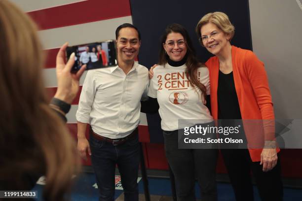 Democratic presidential candidate, Sen. Elizabeth Warren and former U.S. Housing Secretary Julian Castro pose for pictures with guests during a...