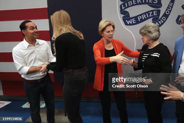 Democratic presidential candidate, Sen. Elizabeth Warren and former U.S. Housing Secretary Julian Castro pose for pictures with guests during a...