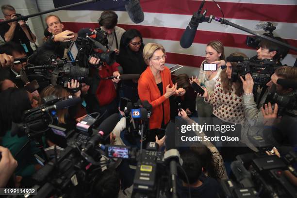 Democratic presidential candidate, Sen. Elizabeth Warren speaks to reporters during a campaign stop at Fisher Elementary School on January 12, 2020...