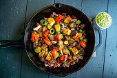 Mediterranean Style Vegetable Medley in a Cast Iron Skillet including Brussels Sprouts, Bell Pepper, Onion, Bacon