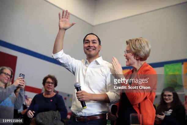 Former housing secretary Julian Castro joins Democratic presidential candidate, Sen. Elizabeth Warren during a campaign stop at Fisher Elementary...