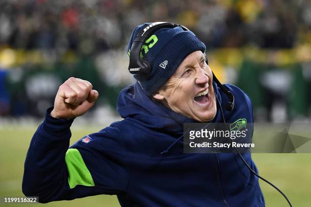 Head coach Pete Carroll of the Seattle Seahawks celebrates after a touchdown during the second half against the Green Bay Packers in the NFC...