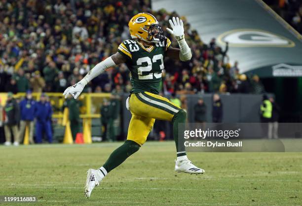 Jaire Alexander of the Green Bay Packers celebrates making a sack on a 2-point conversion against the Seattle Seahawks in the second half of the NFC...