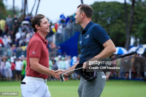 Cameron Smith of Australia shakes hands with Brendan Steele of the United States on the 18th green prior to their playoff during the final round of...