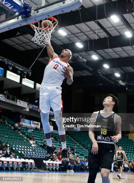 Donte Grantham of the Agua Caliente Clippers dunks gains Yudai Baba of the Texas Legends during the first quarter on February 06, 2020 at Comerica...