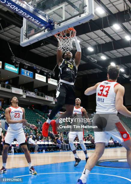 Chad Brown of the Texas Legends dunks against J. J. Avila of the Agua Caliente Clippers during the fourth quarter on February 06, 2020 at Comerica...