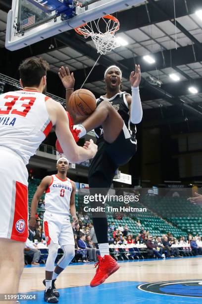 Chad Brown of the Texas Legends dunks against J. J. Avila of the Agua Caliente Clippers during the fourth quarter on February 06, 2020 at Comerica...