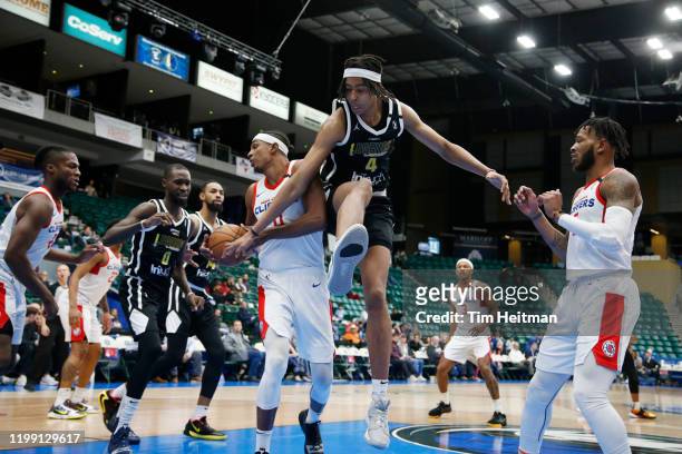 Donte Grantham of the Agua Caliente Clippers grabs a rebound against Moses Brown of the Texas Legends during the fourth quarter on February 06, 2020...