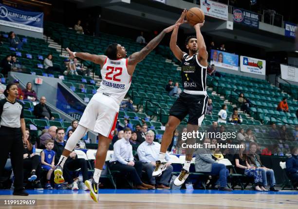 Cameron Payne of the Texas Legends shoots against Xavier Rathan-Mayes of the Agua Caliente Clippers during the fourth quarter on February 06, 2020 at...