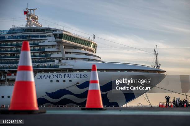 The Diamond Princess cruise ship sits docked at Daikoku Pier where it is being resupplied and newly diagnosed coronavirus cases taken for treatment...