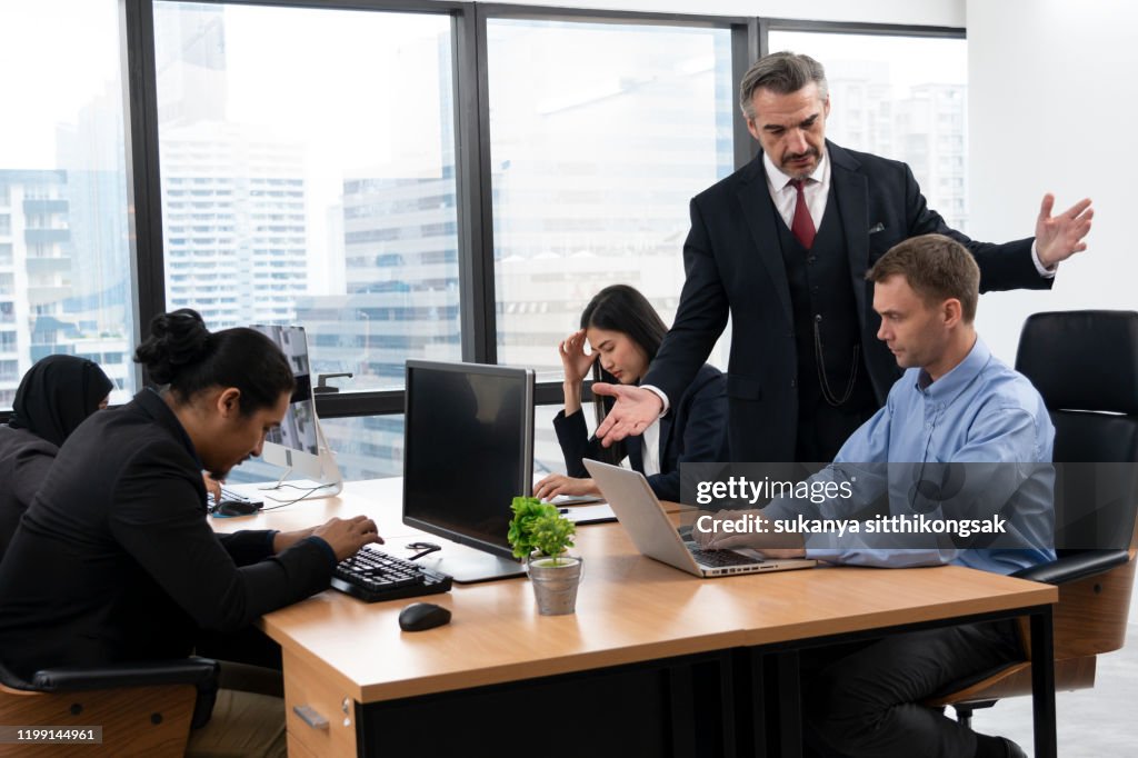 The frustrated CEO is angry with his co-worker during an office meeting.