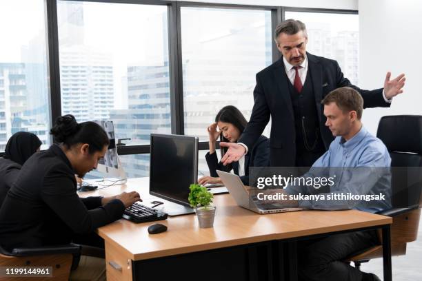 the frustrated ceo is angry with his co-worker during an office meeting. - dominerande bildbanksfoton och bilder