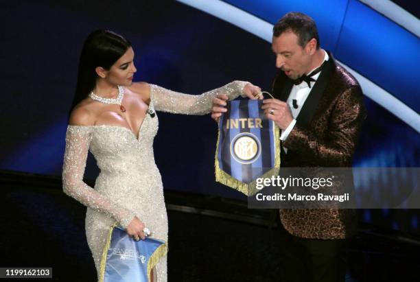 Talian Sanremo Festival artistic director Amadeus and Argentine model Georgina Rodriguez , partner of Portuguese soccer star Cristiano Ronaldo, pose...