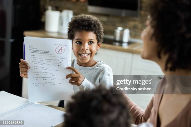 look mommy, i've got an a on my test! - child report card stock pictures, royalty-free photos & images