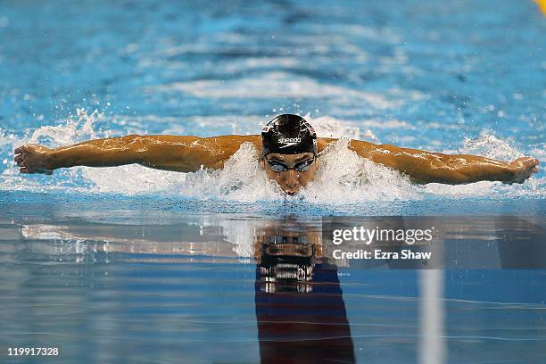 Michael Phelps of the United States competes on the way to winning the gold medal in the Men's 200m Butterfly Final during Day Twelve of the 14th...