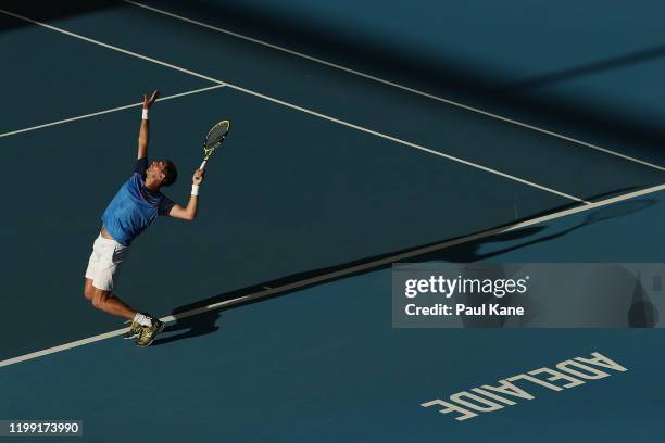 Federico Delbonis of Argentina serves to James Duckworth of Australia during day two of the 2020 Adelaide International at Memorial Drive on January...