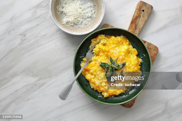 creamy baked pumpkin risotto - risoto stock pictures, royalty-free photos & images