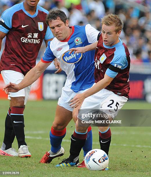 David Dunn of Blackburn battles for the ball with Barry Bannan of Aston Villa during their Barclays Asia Trophy football match at Hong Kong stadium...