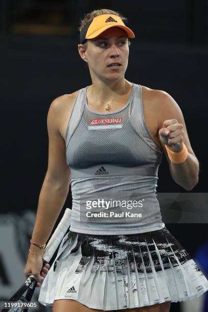 Angelique Kerber of Germany celebrates winning a game in her match against Qiang Wang of China during day two of the 2020 Adelaide International at...