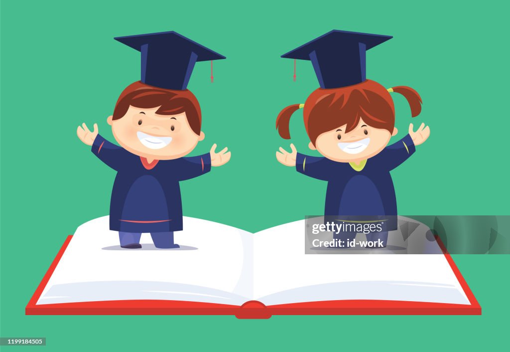Happy graduates standing on book and cheering