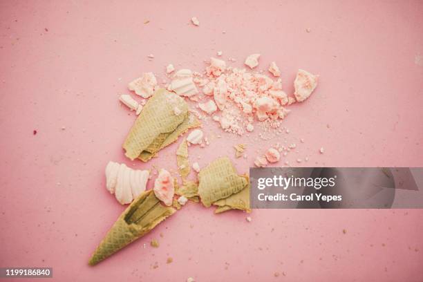 smashed ice cones in pink background - icehorn stock pictures, royalty-free photos & images