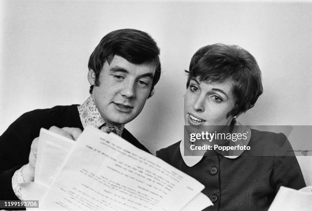 English actor and comedian Michael Palin reads a script with his wife Helen Gibbins in London in February 1968. Michael Palin currently writes for...