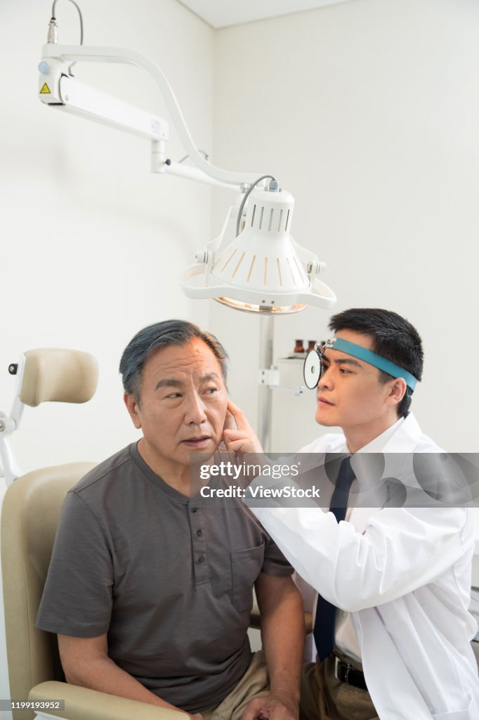 Doctor Looking In Ear Doctors Give Patients To Check The Ear High-Res Stock Photo - Getty Images