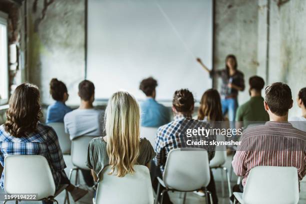 back view of design professionals having training class in the office. - education stock pictures, royalty-free photos & images