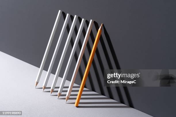 pencils with shadow triangle shape - yellow pencil stock pictures, royalty-free photos & images