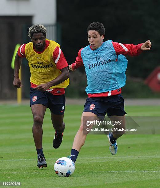 Alex Song and Samoir Nasri of Arsenal compete for the ball during a training session as part of the club's pre-season preparations on July 27, 2011...