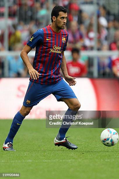 Pedro of Barcelona runs with the ball during the Audi Cup match between FC Barcelona and International de Porto Alegre at Allianz Arena on July 26,...