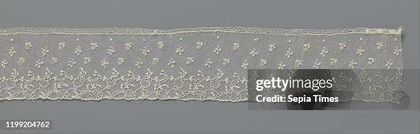 Strip of needle lace with poppy bulbs, Strip of natural colored needle lace: Alencon lace. Scatter motif with three rows of twigs with oval leaves...