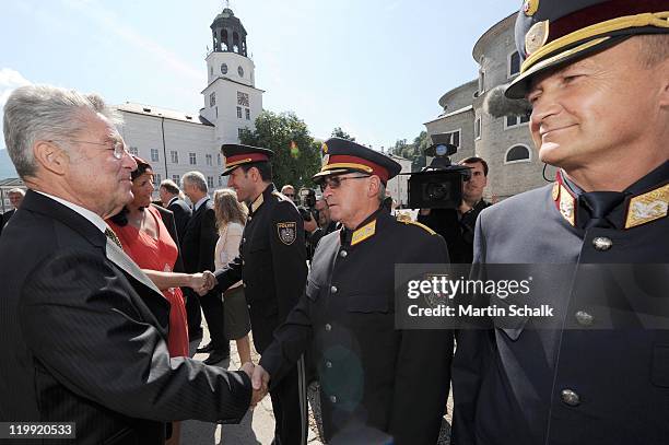 Austrian Federal President Heinz Fischer meets police officers prior to the opening reception during the Salzburg Festival at Felsenreitschule on...