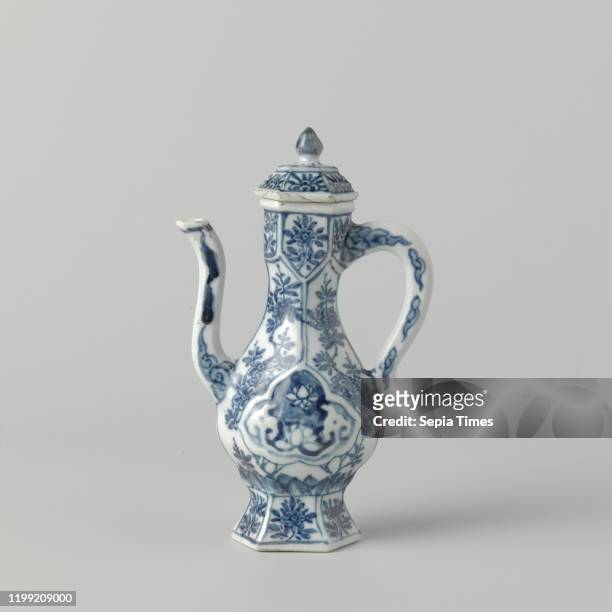 Hexagonal ewer with flowering plants and floral scrolls, Hexagonal jug made of porcelain with a pear-shaped body, long, S-shaped spout and S-shaped...